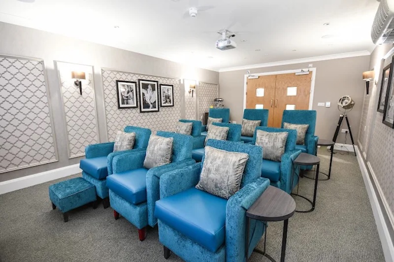 cinema room with blue chairs