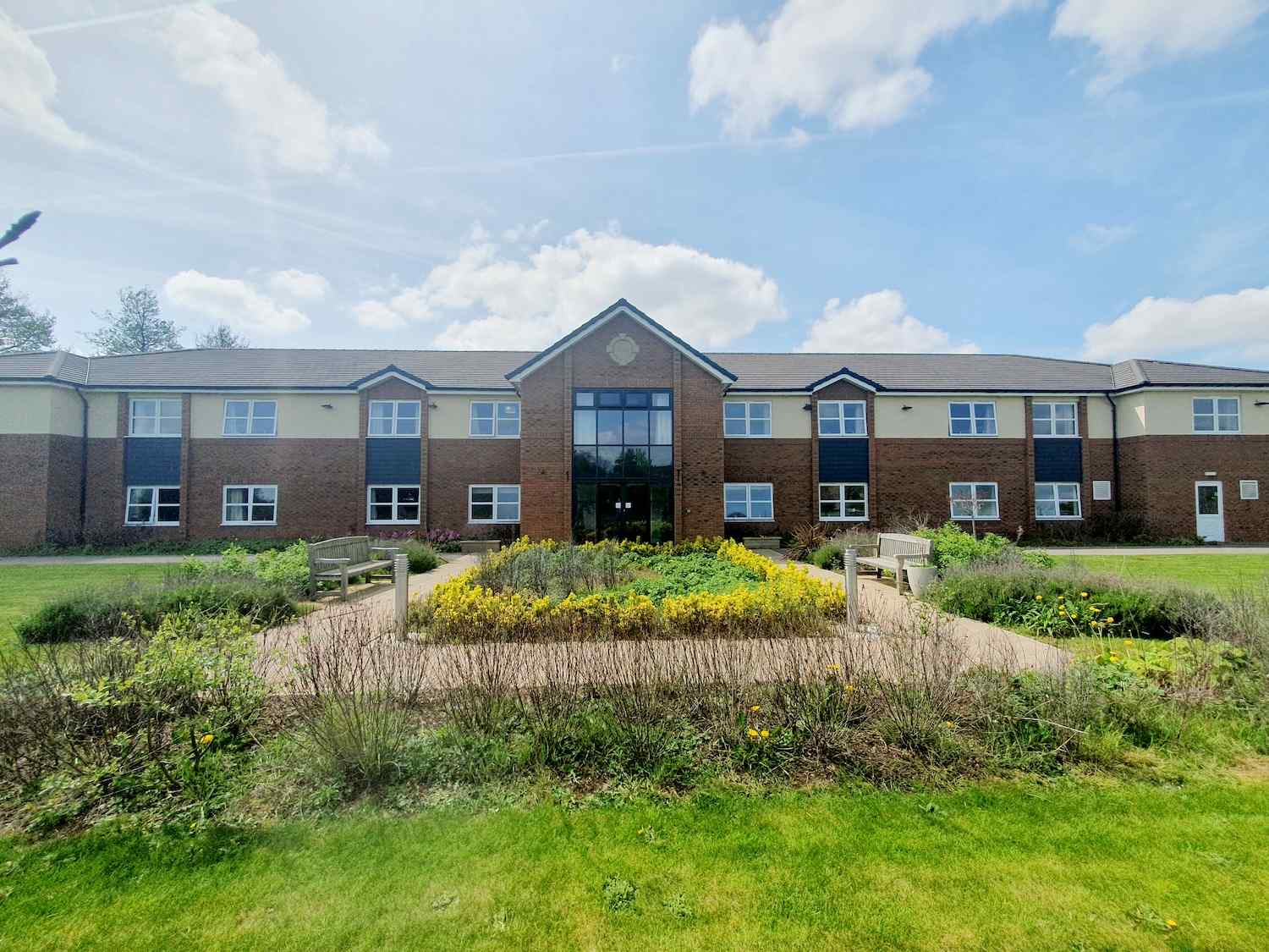 exterior of our home with plants and grass area