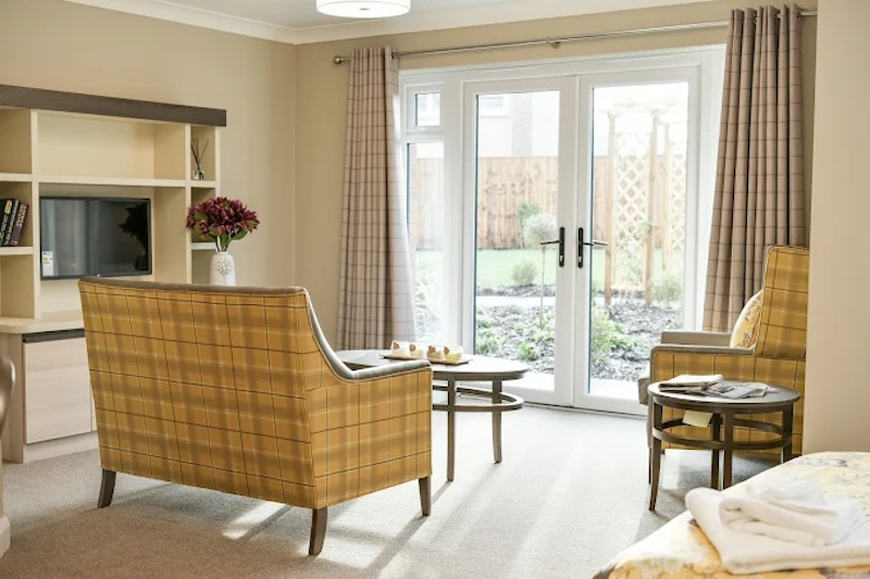 yellow sofa area with a view into our garden