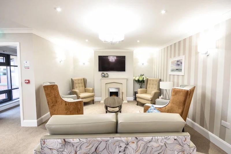 lounge with group of sofas sat around the TV